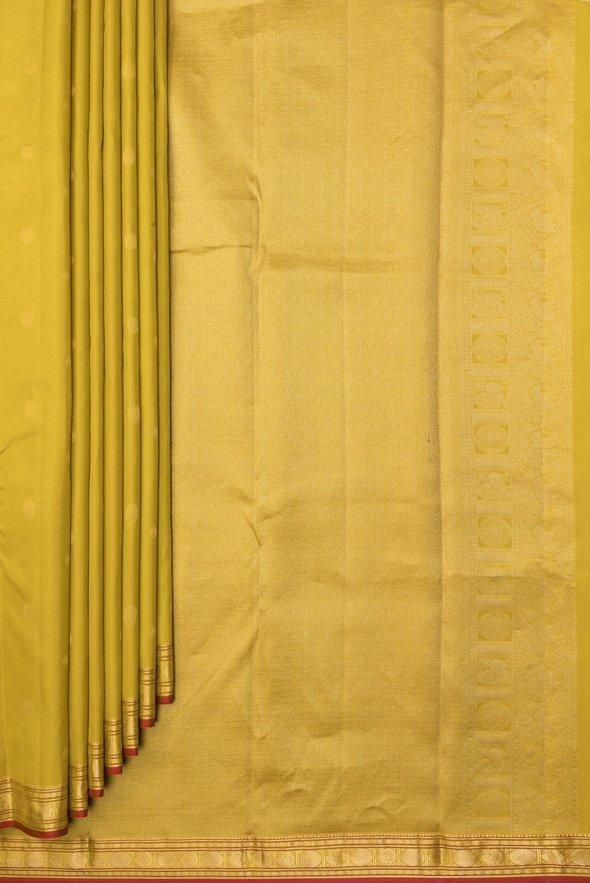 Pleats and pallu of Lemon Yellow Kanchipuram Silk Saree with Zari Butta on the body and Zari Border. 