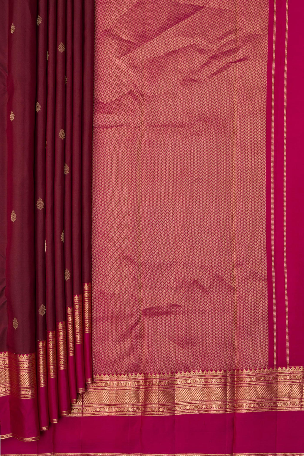 Pleats and pallu of Maroon Kanchipuram Silk Saree with Zari Butta on the body and Ganga Jamuna Border. 