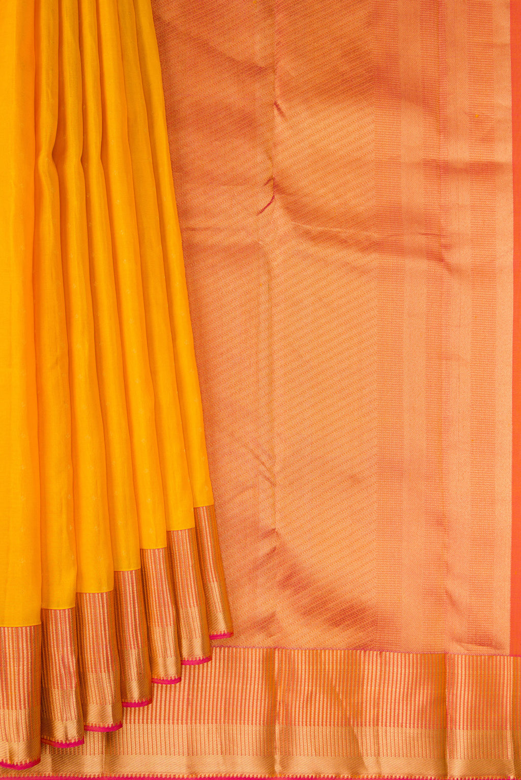 Pleats and pallu of Yellow Kanchipuram Silk Saree with Zari Butta on the body and Fancy Border. 