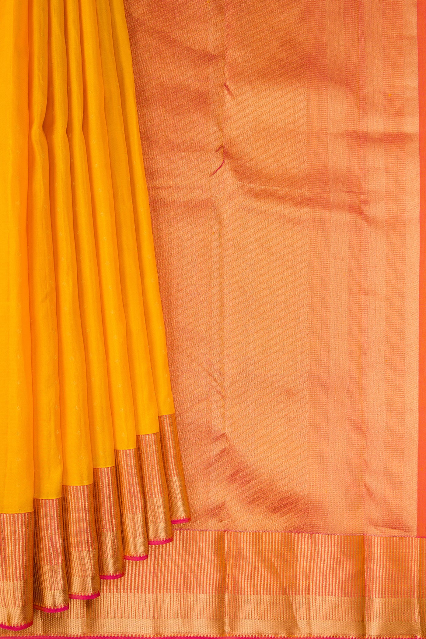 Pleats and pallu of Yellow Kanchipuram Silk Saree with Zari Butta on the body and Fancy Border. 