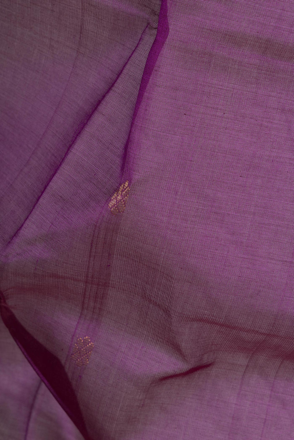 Close up of Purple Dual Tone Silk Cotton Saree with Zari Butta on the body and Zari Border.  displaying folds
