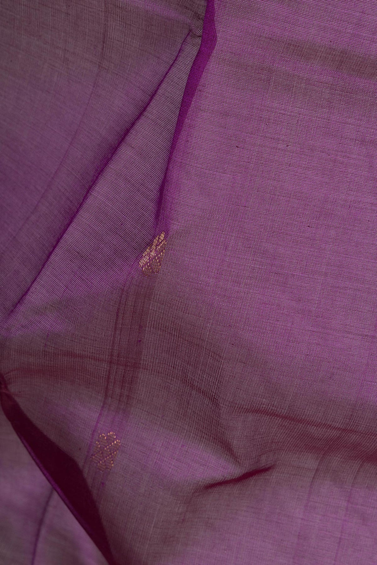 Close up of Purple Dual Tone Silk Cotton Saree with Zari Butta on the body and Zari Border.  displaying folds