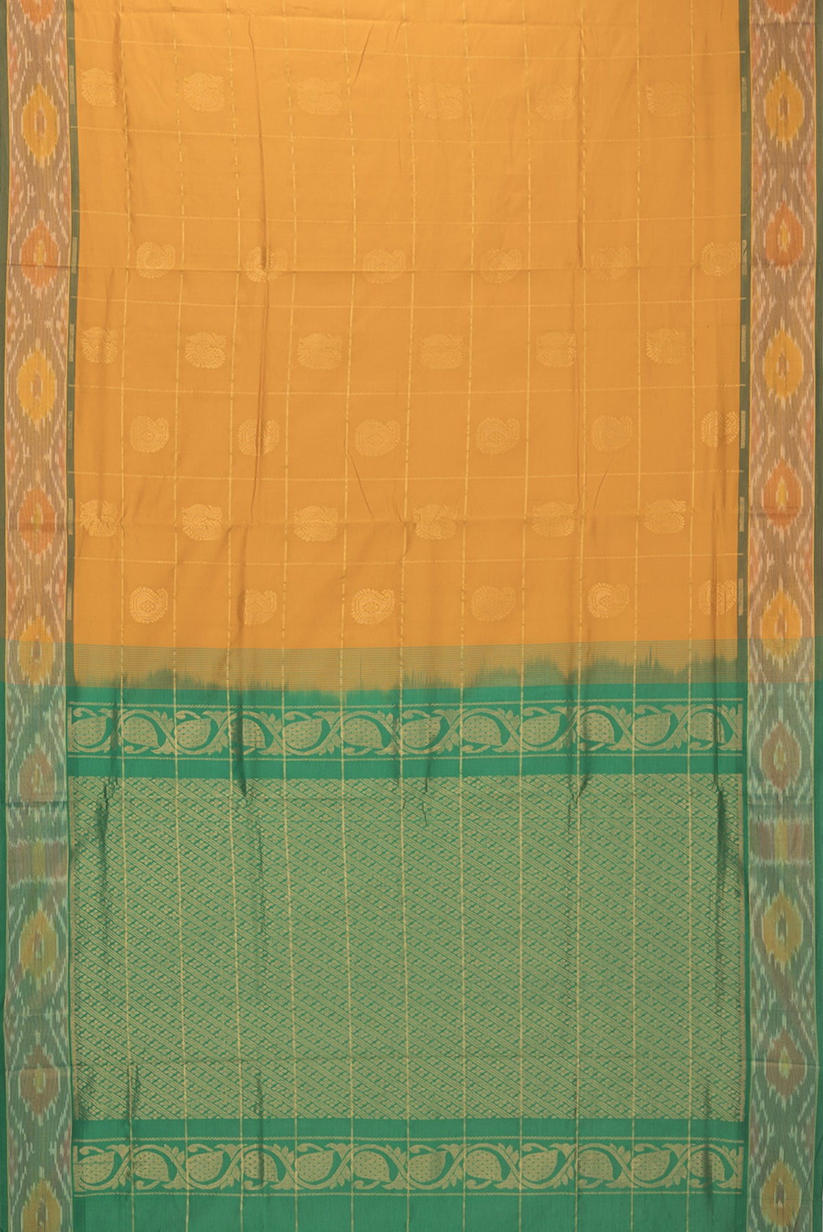 Flat view of Mustard Silk Cotton Saree with Checked design on the body and Ikat Border. 