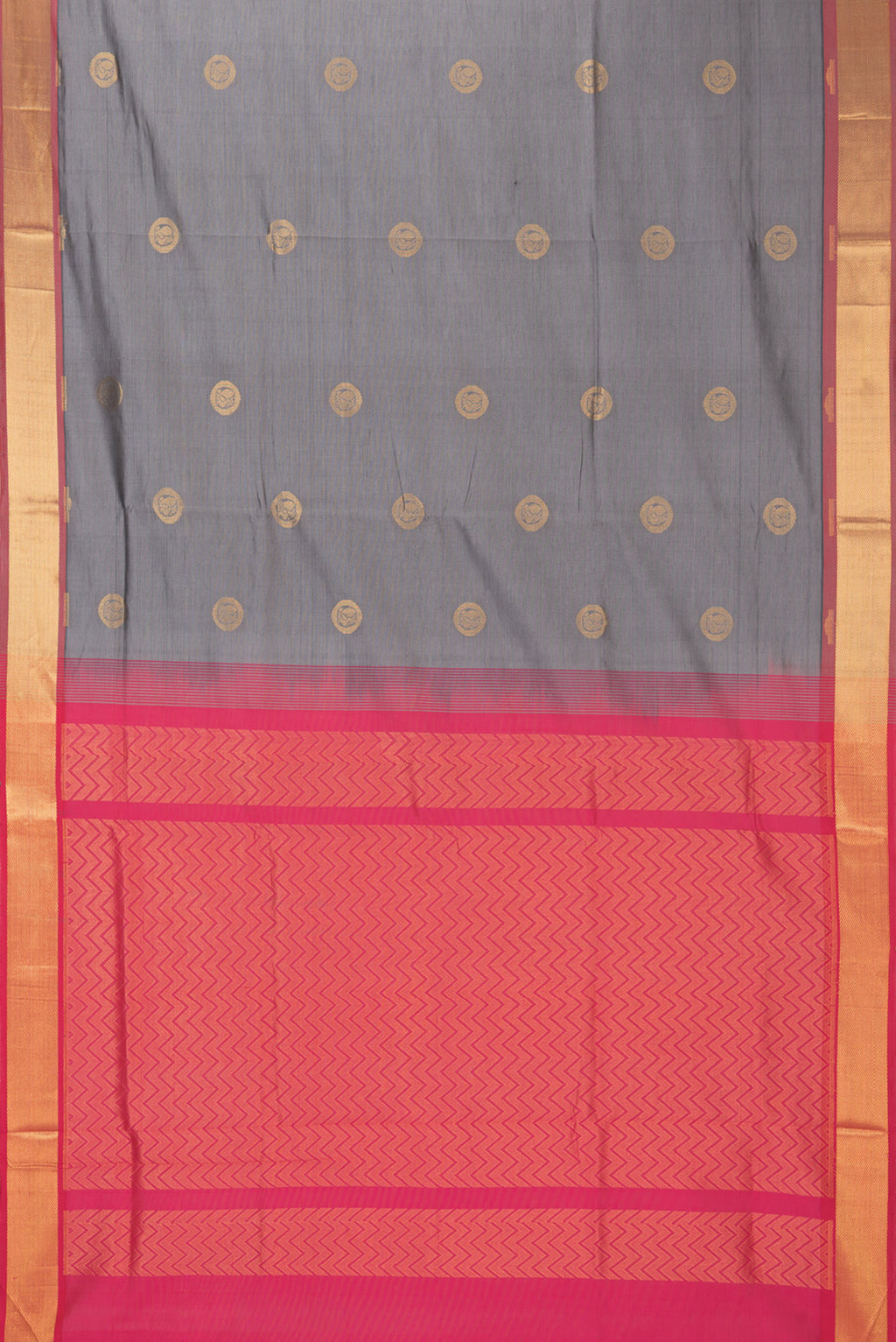 Flat view of Grey Silk Cotton Saree with Zari Butta on the body and Zari Border. 