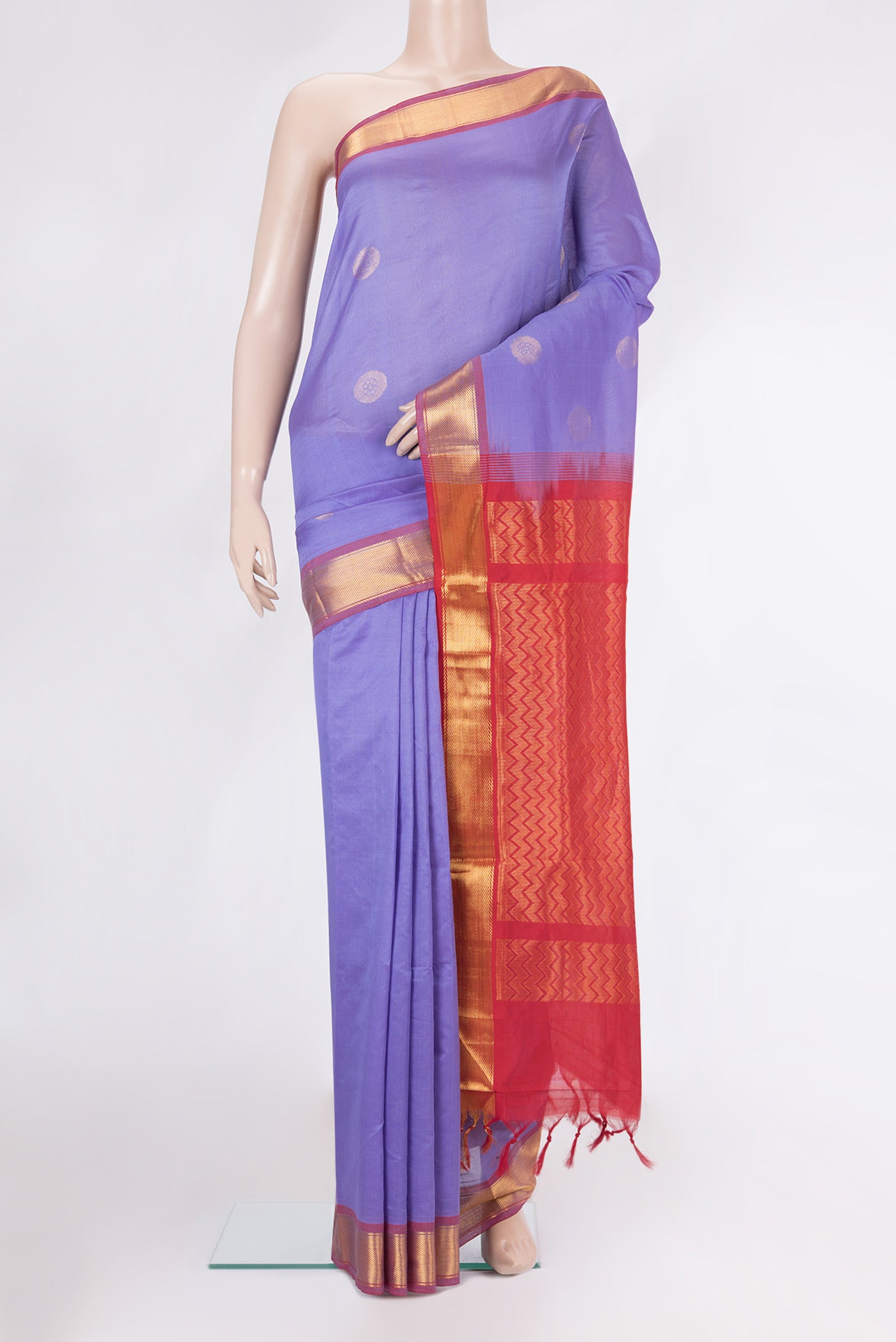 Lavender Silk Cotton Saree with Zari Butta on the body and Zari Border.  displayed on a mannequin