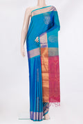 Pure Silk Peacock Blue Soft Saree with Zari Butta on the body and Zari Border.  displayed on a mannequin