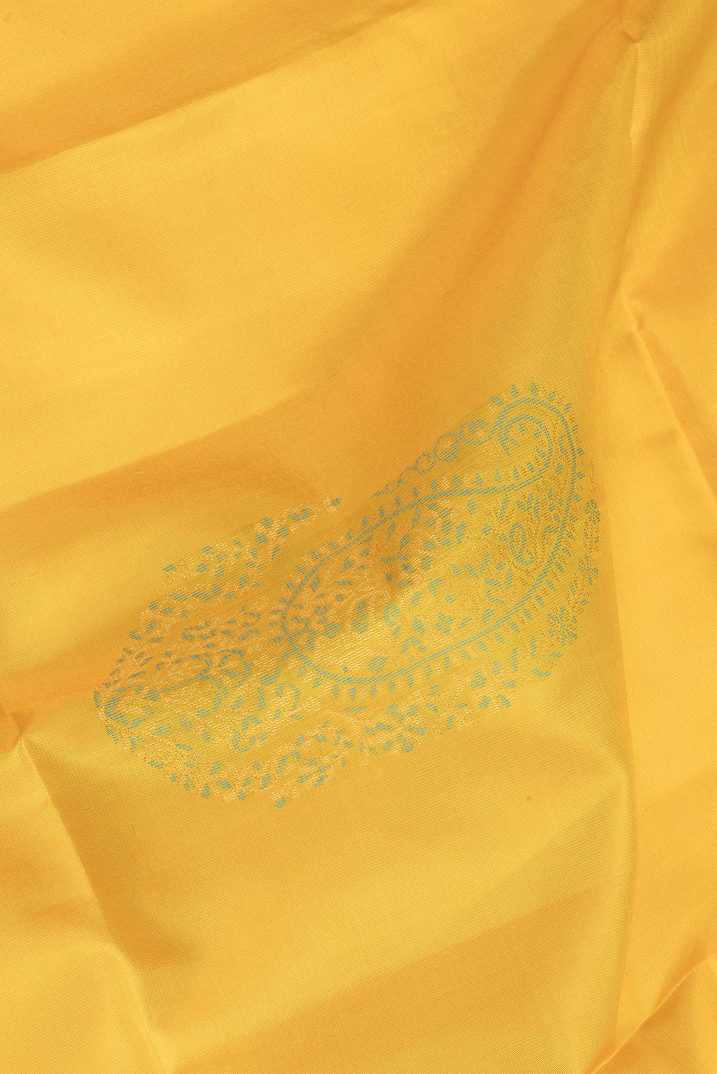 Close up of Pure Silk Yellow Soft Saree with Zari And Thread Butta on the body and Zari Border.  displaying folds