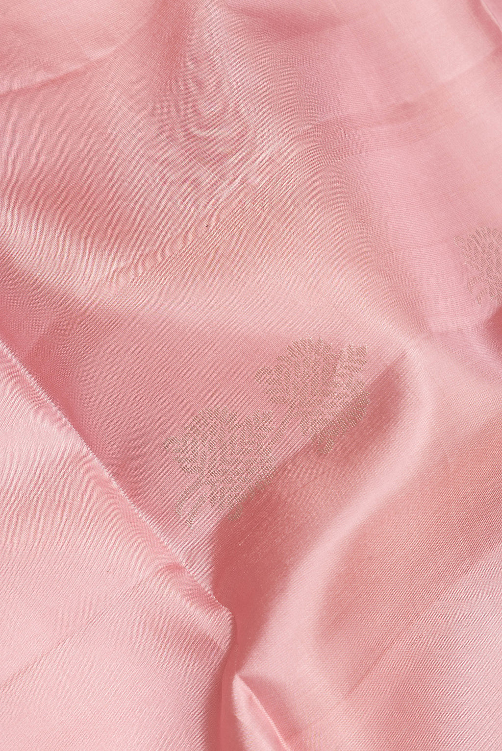 Close up of Pure Silk Rose pink Soft Saree with Zari Butta on the body and Zari Border.  displaying folds