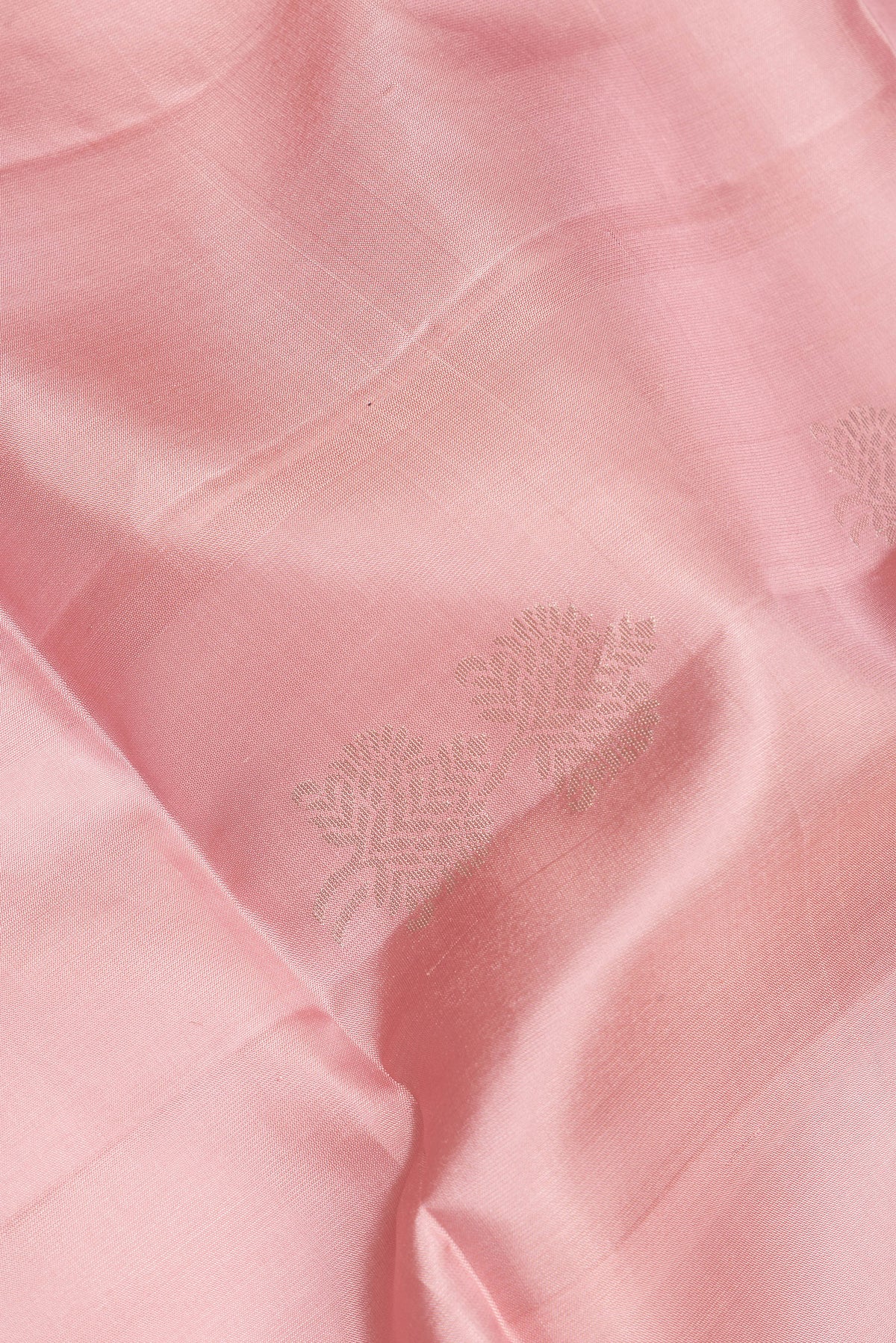 Close up of Pure Silk Rose pink Soft Saree with Zari Butta on the body and Zari Border.  displaying folds
