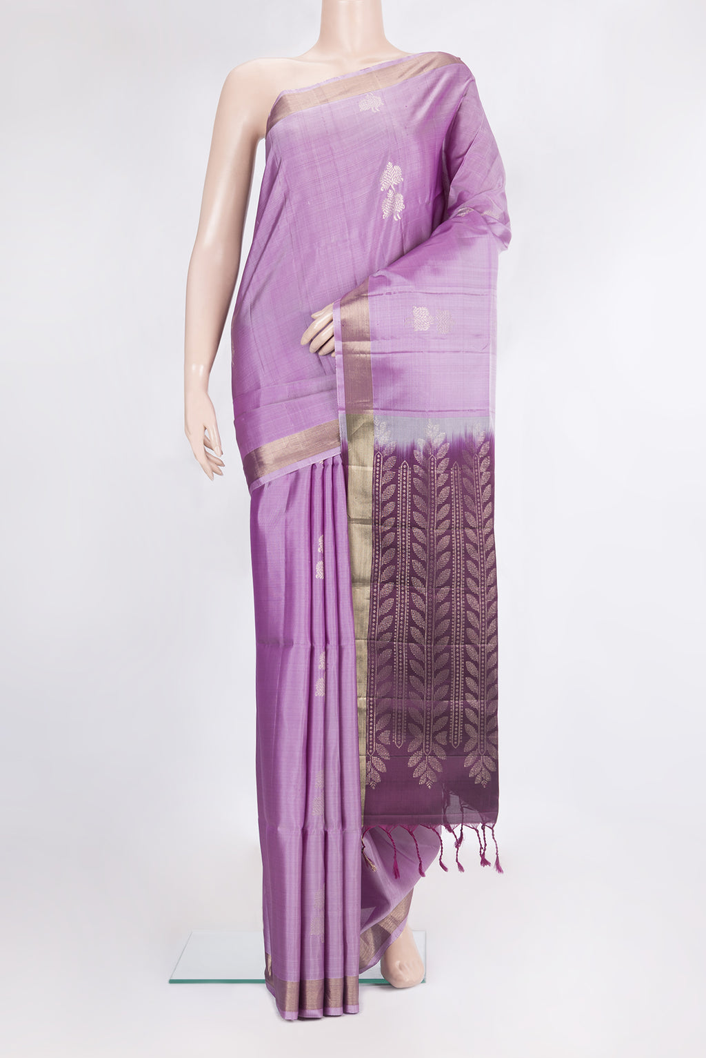 Pure Silk Lavender Soft Saree with Zari Butta on the body and Zari Border.  displayed on a mannequin