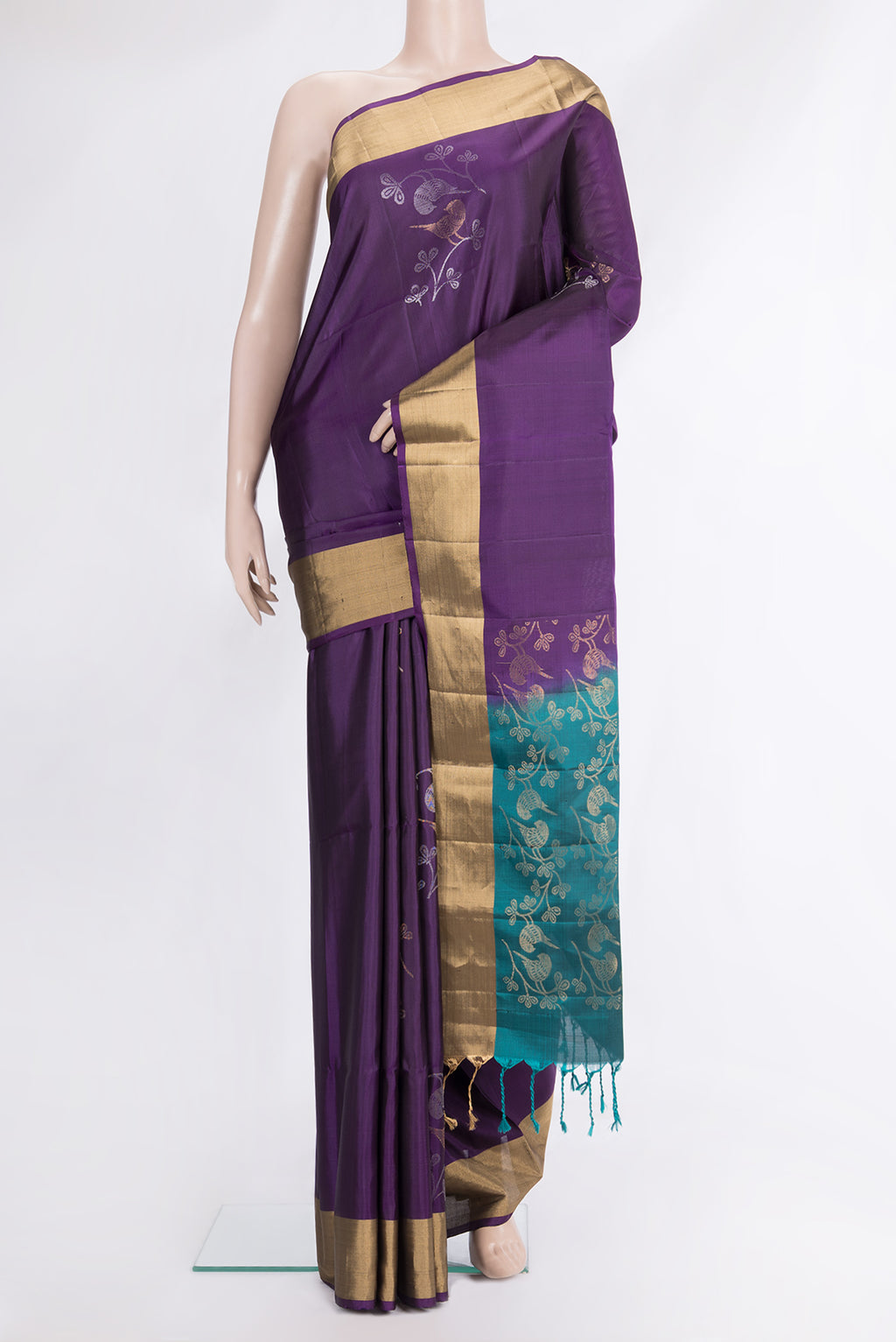 Pure Silk Purple Soft Saree with Zari Butta on the body and Zari Border.  displayed on a mannequin