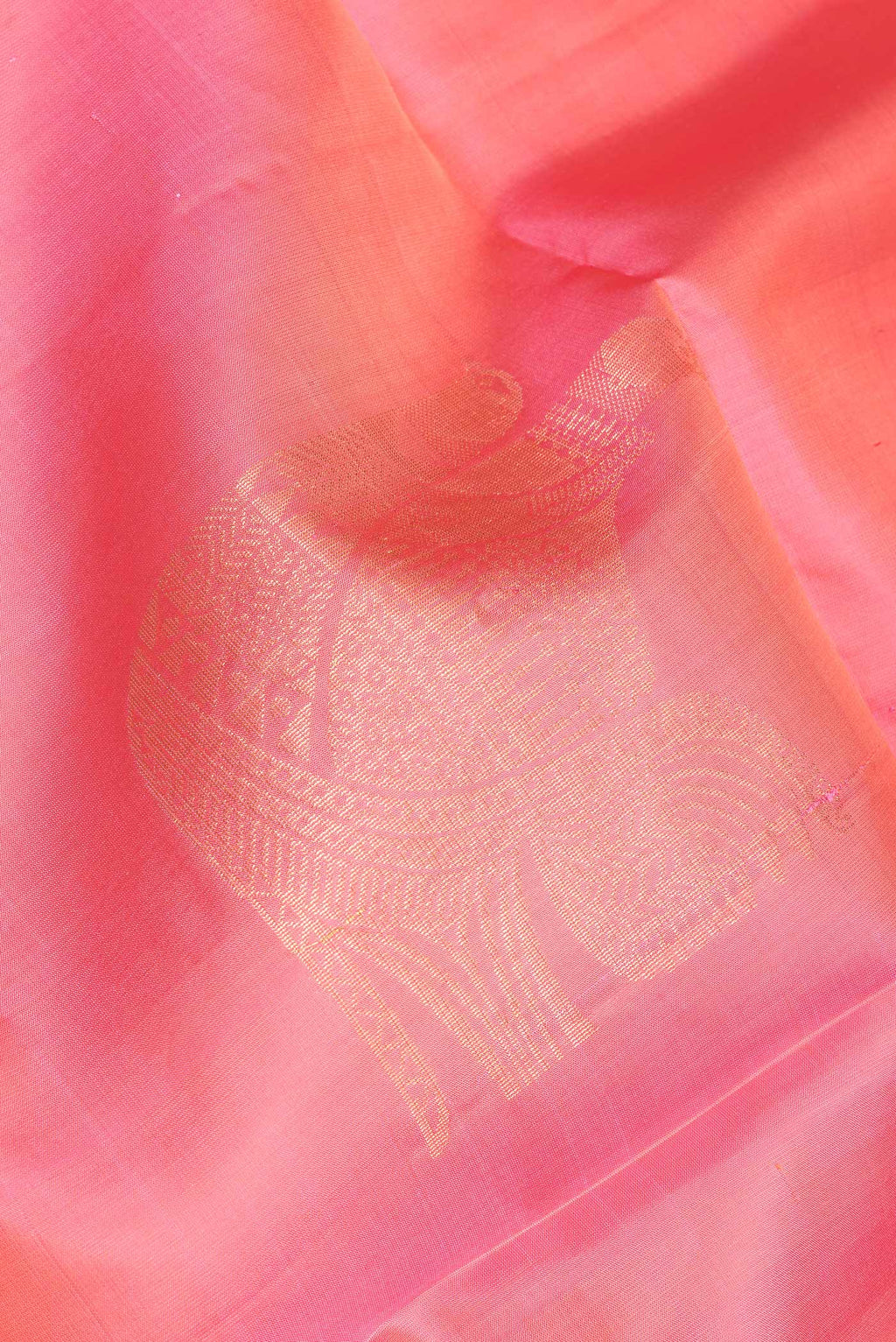 Close up of Pink Soft Silk Saree with Zari Butta on the body and Zari Border.  displaying folds