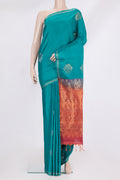 Pure Silk Peacock Blue Soft Saree with Zari Butta on the body and Zari Border.  displayed on a mannequin