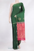 Pure Silk Bottle Green Soft Saree with Zari Butta on the body and Zari Border.  displayed on a mannequin