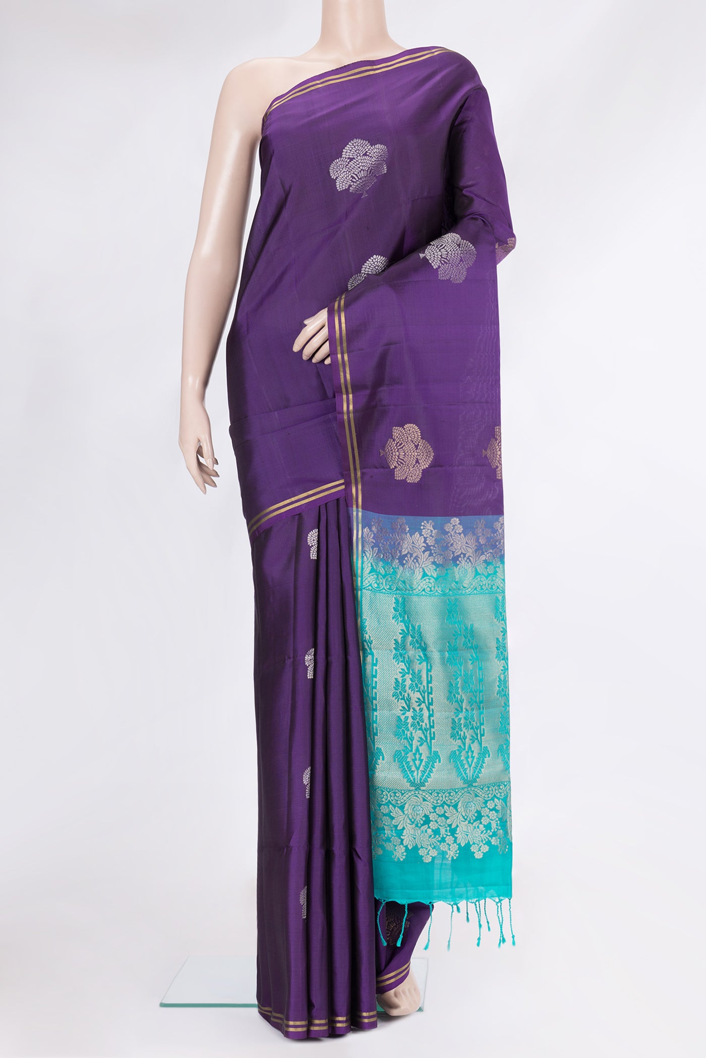 Purple Soft Silk Saree with Zari Butta on the body and Zari Border.  displayed on a mannequin