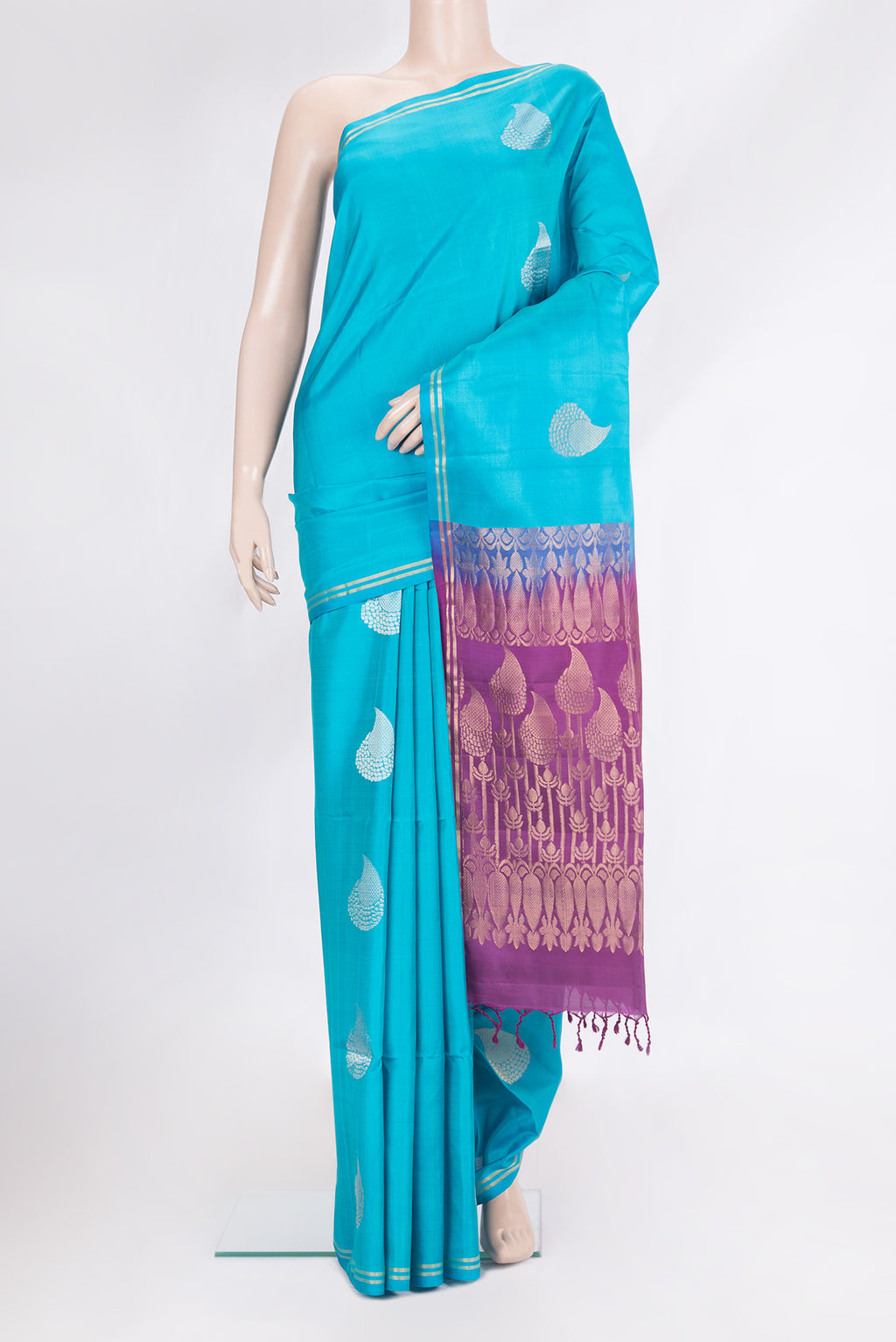 Pure Silk Sky Blue Soft Saree with Zari Butta on the body and Zari Border.  displayed on a mannequin
