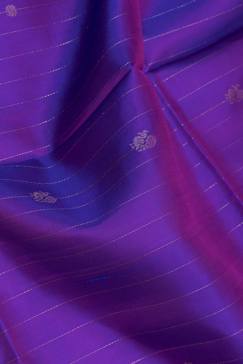 Close up of Purple Soft Silk Saree with Stripes on the body and Zari Border.  displaying folds