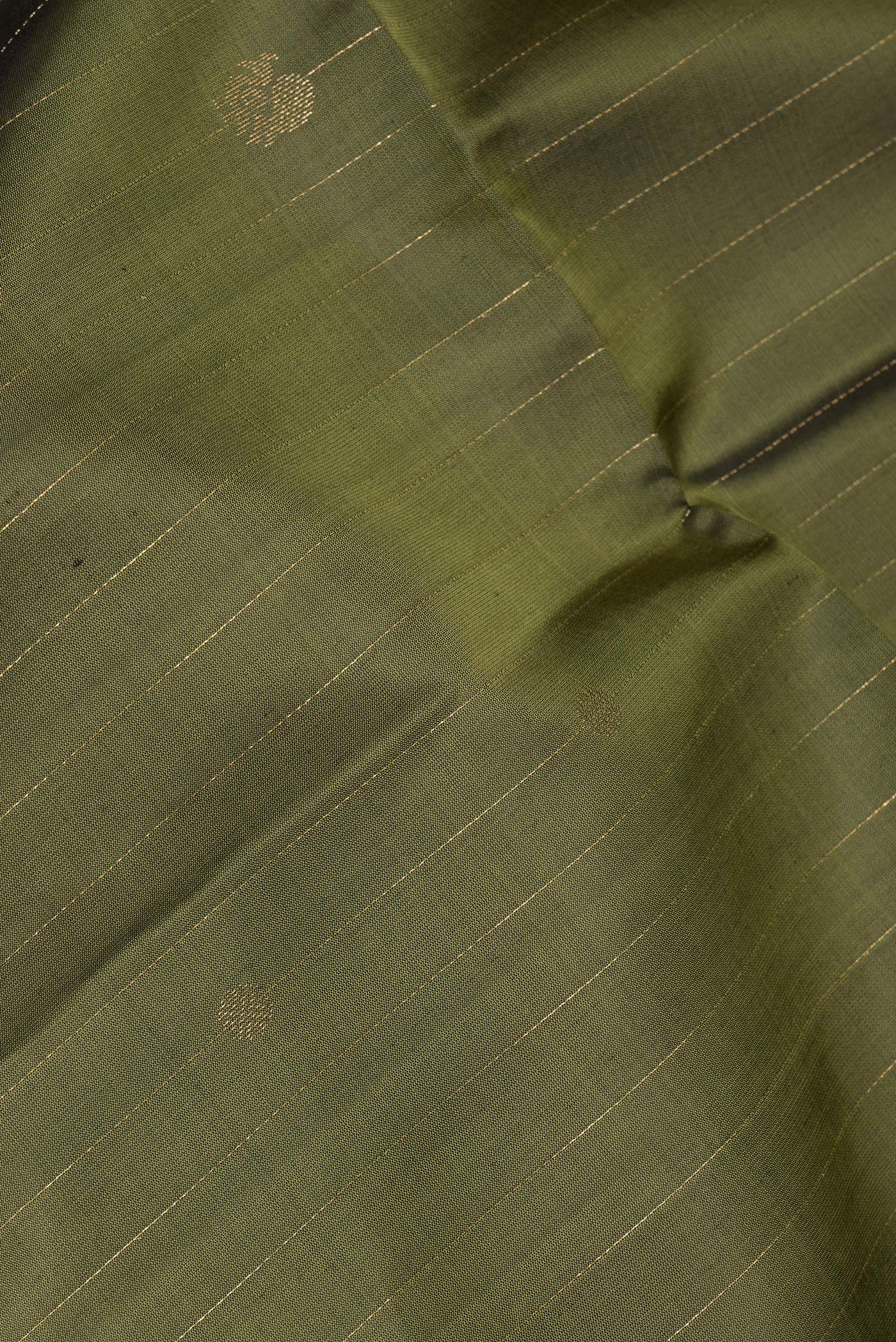 Close up of Pure Silk Mehandi Green Soft Saree with Stripes on the body and Zari Border.  displaying folds