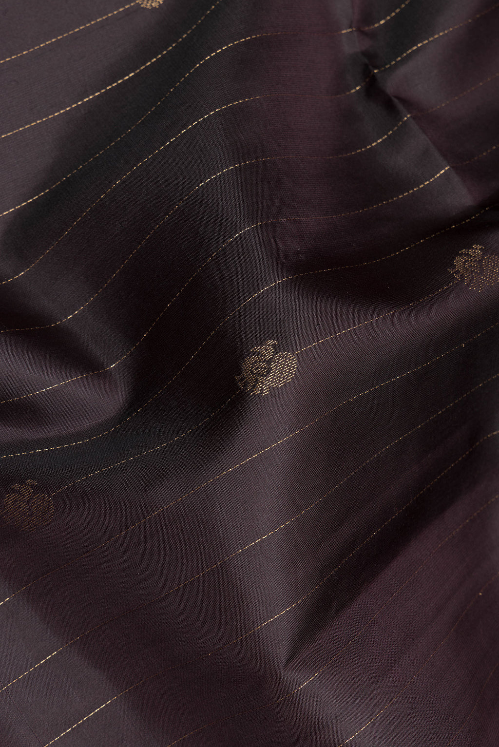 Close up of Pure Silk Brown Soft Saree with Stripes on the body and Zari Border.  displaying folds