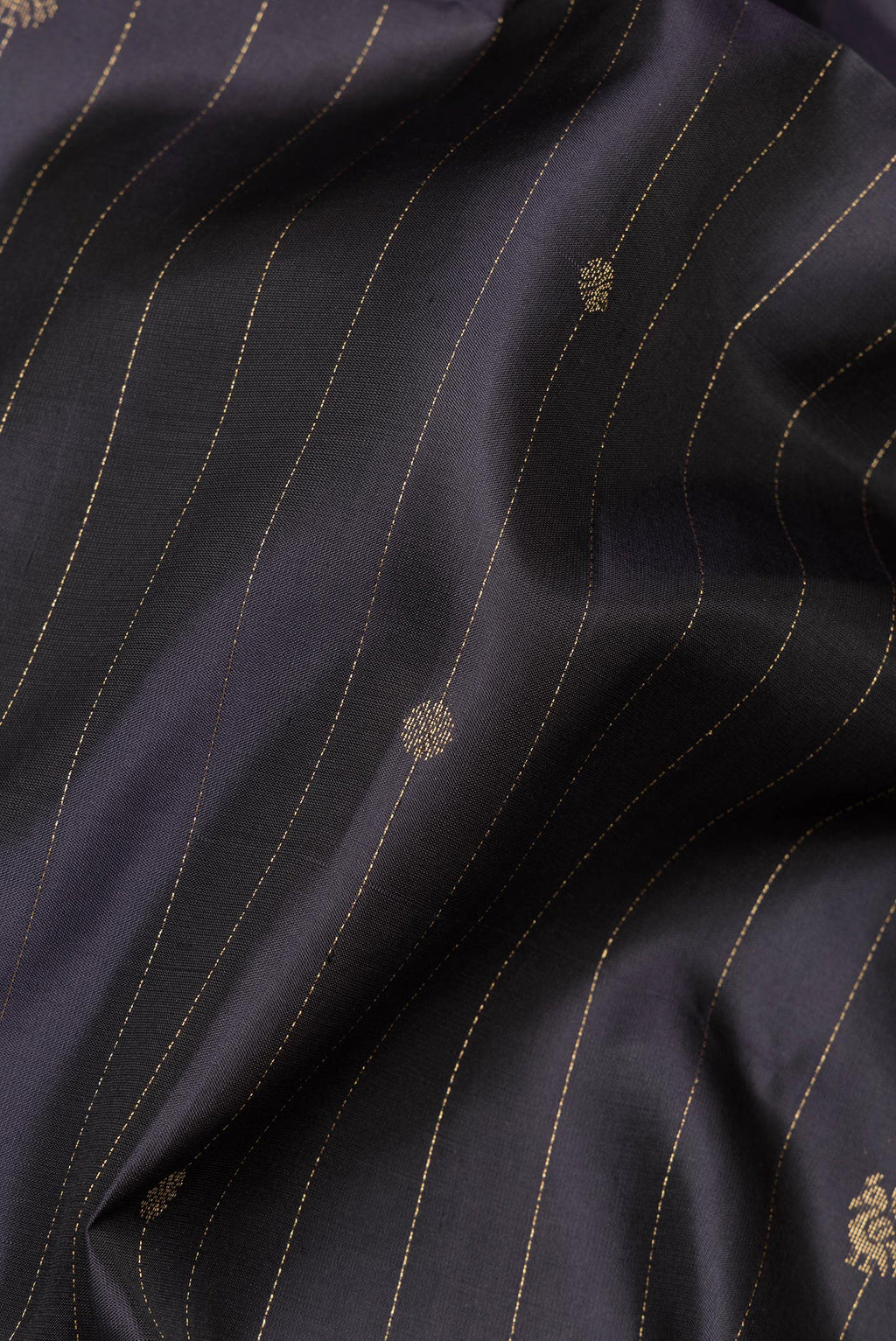 Close up of Pure Silk Black Soft Saree with Stripes on the body and Zari Border.  displaying folds