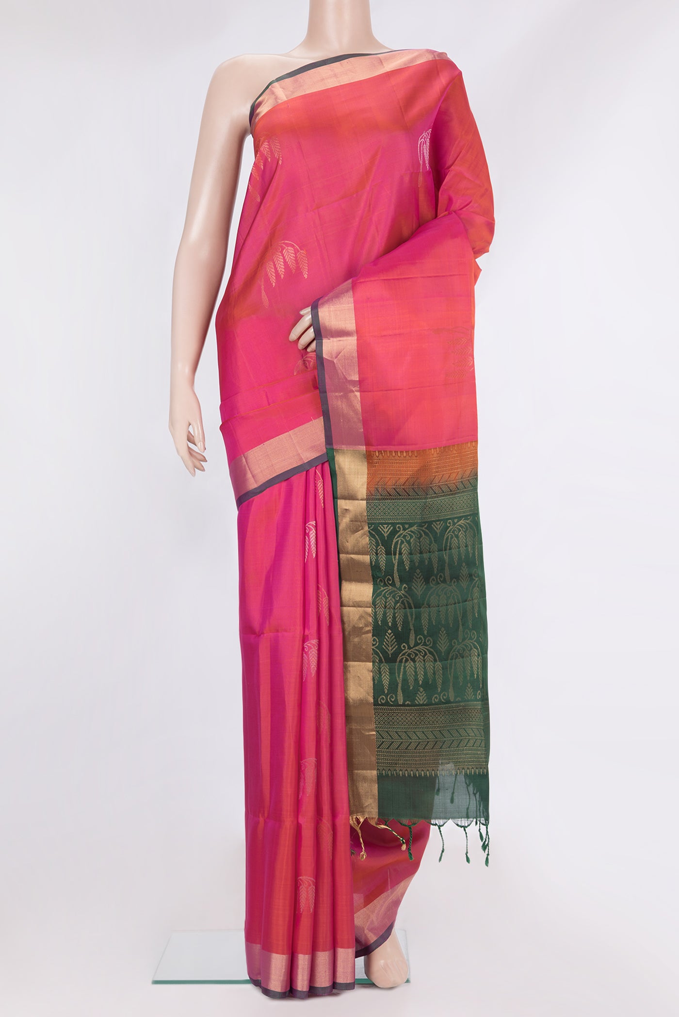 Pure Silk Pink Soft Saree with Zari Butta on the body and Zari Border.  displayed on a mannequin