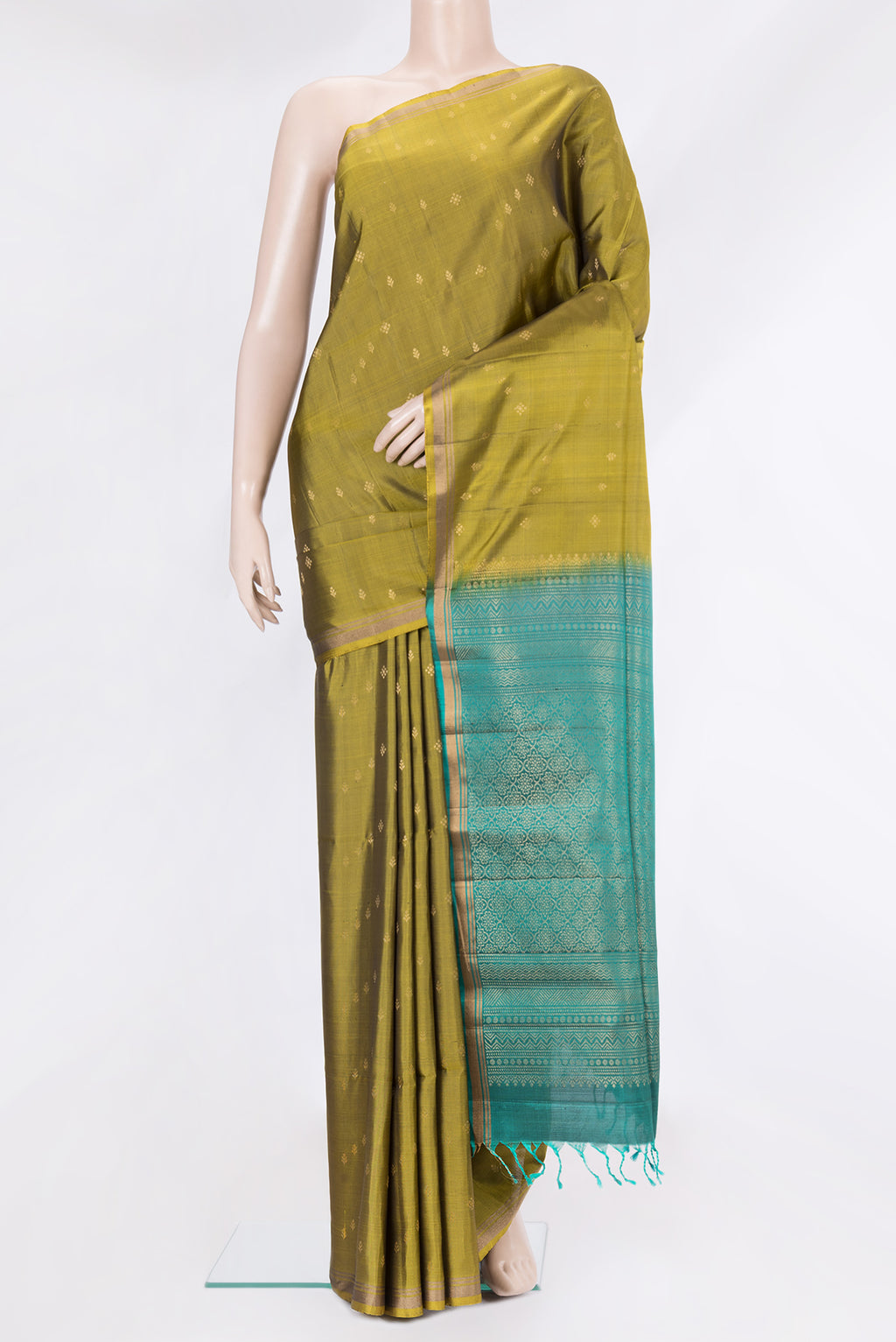 Mehandi Green Soft Silk Saree with Zari Butta on the body and Zari Border.  displayed on a mannequin