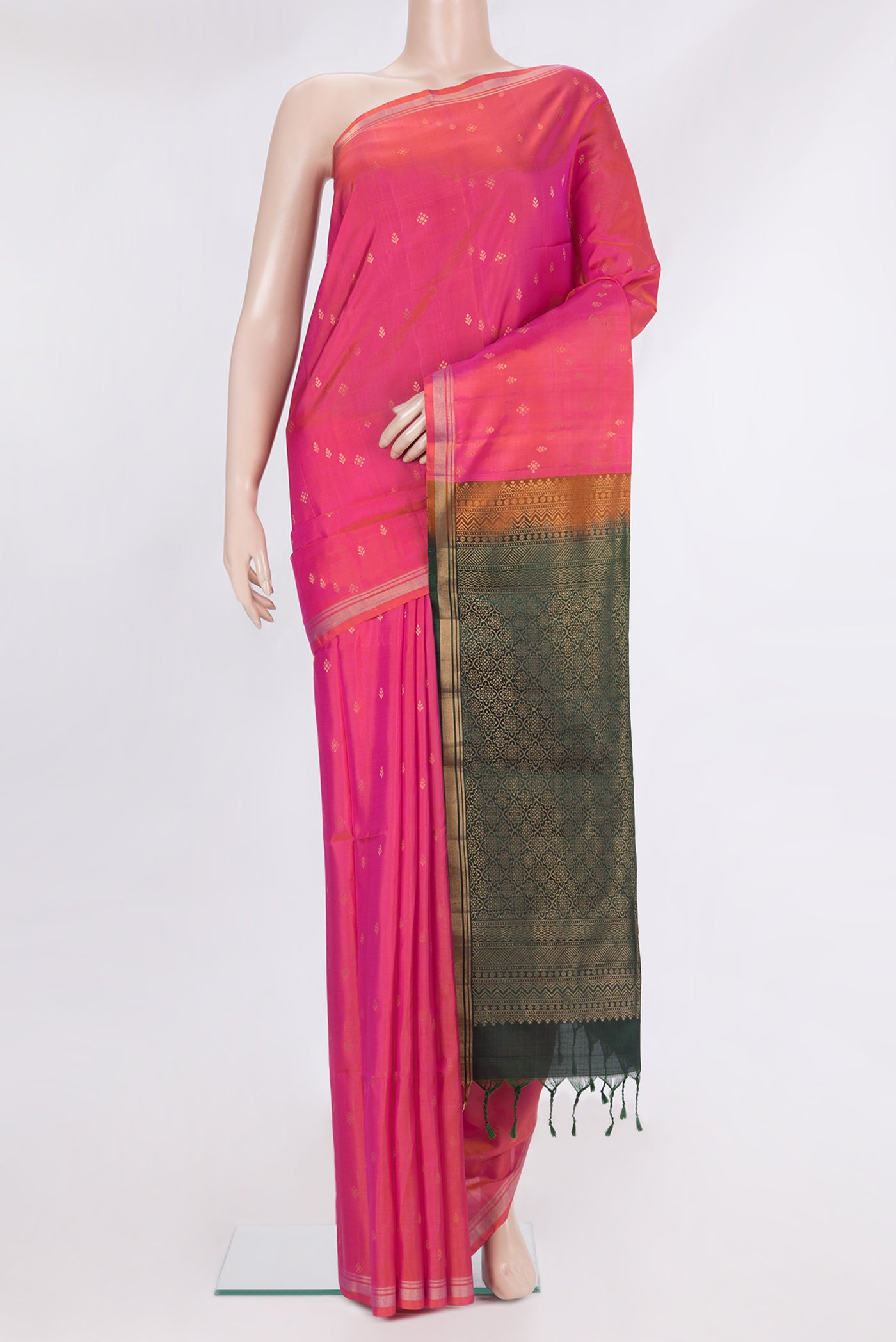 Pure Silk Pink Soft Saree with Zari Butta on the body and Zari Border.  displayed on a mannequin