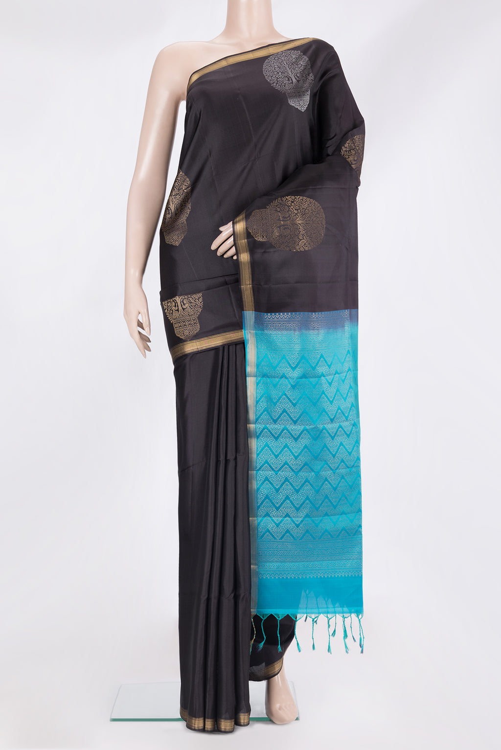 Pure Silk Black Soft Saree with Zari Butta on the body and Zari Border.  displayed on a mannequin