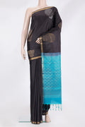 Pure Silk Black Soft Saree with Zari Butta on the body and Zari Border.  displayed on a mannequin
