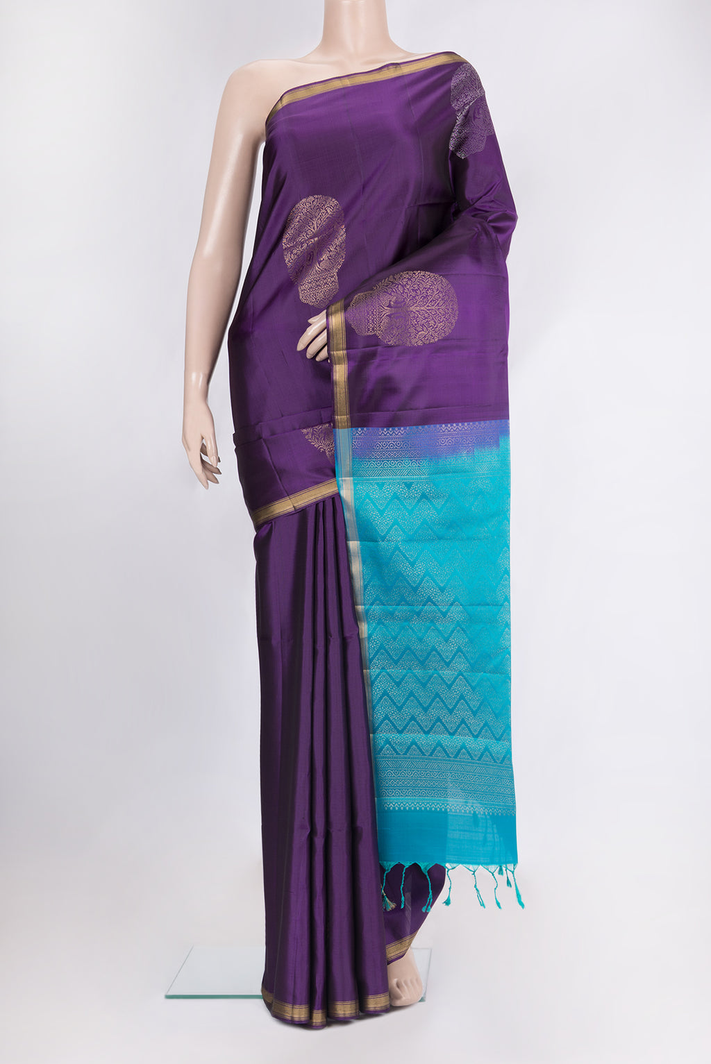 Pure Silk Purple Soft Saree with Zari Butta on the body and Zari Border.  displayed on a mannequin