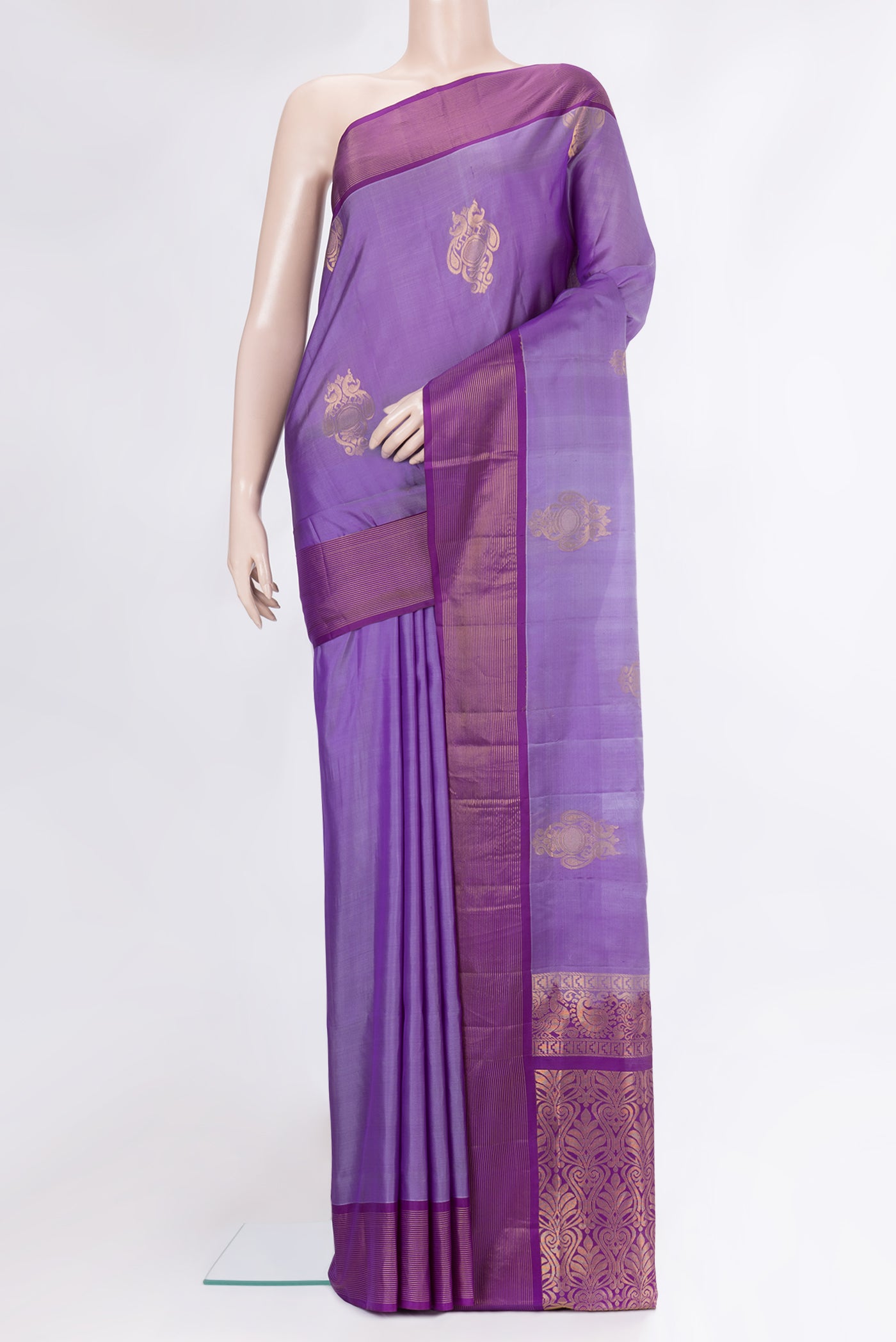 Lavender Soft Silk Saree with Zari Butta on the body and Zari Border.  displayed on a mannequin