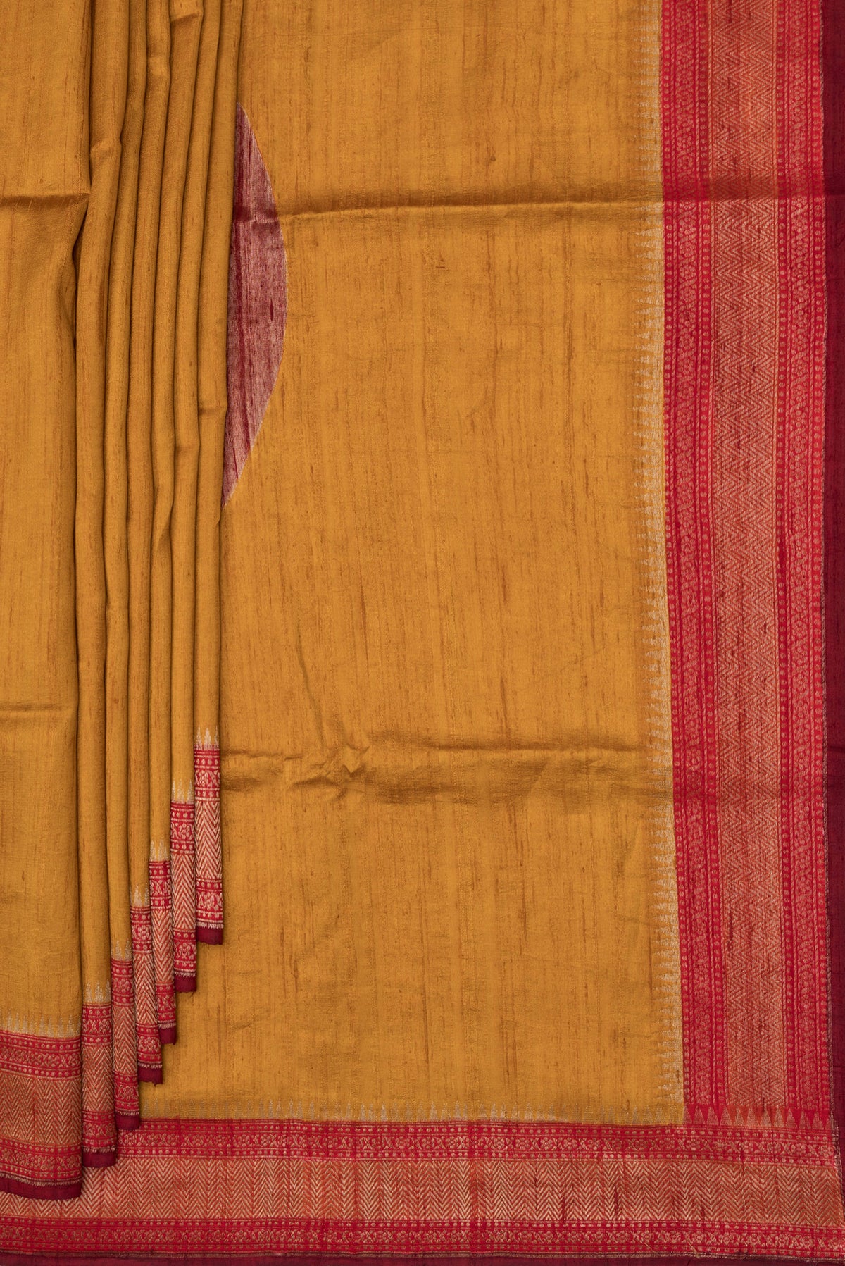 Pleats and pallu of Pure Silk Mustard Raw Saree with Plain Body and Zari Border. 