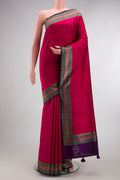 Rani Pink Tussar Saree with Plain Body and Fancy Border.  displayed on a mannequin