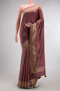 Brown Tussar Saree with Thread Butta on the body and Fancy Border.  displayed on a mannequin