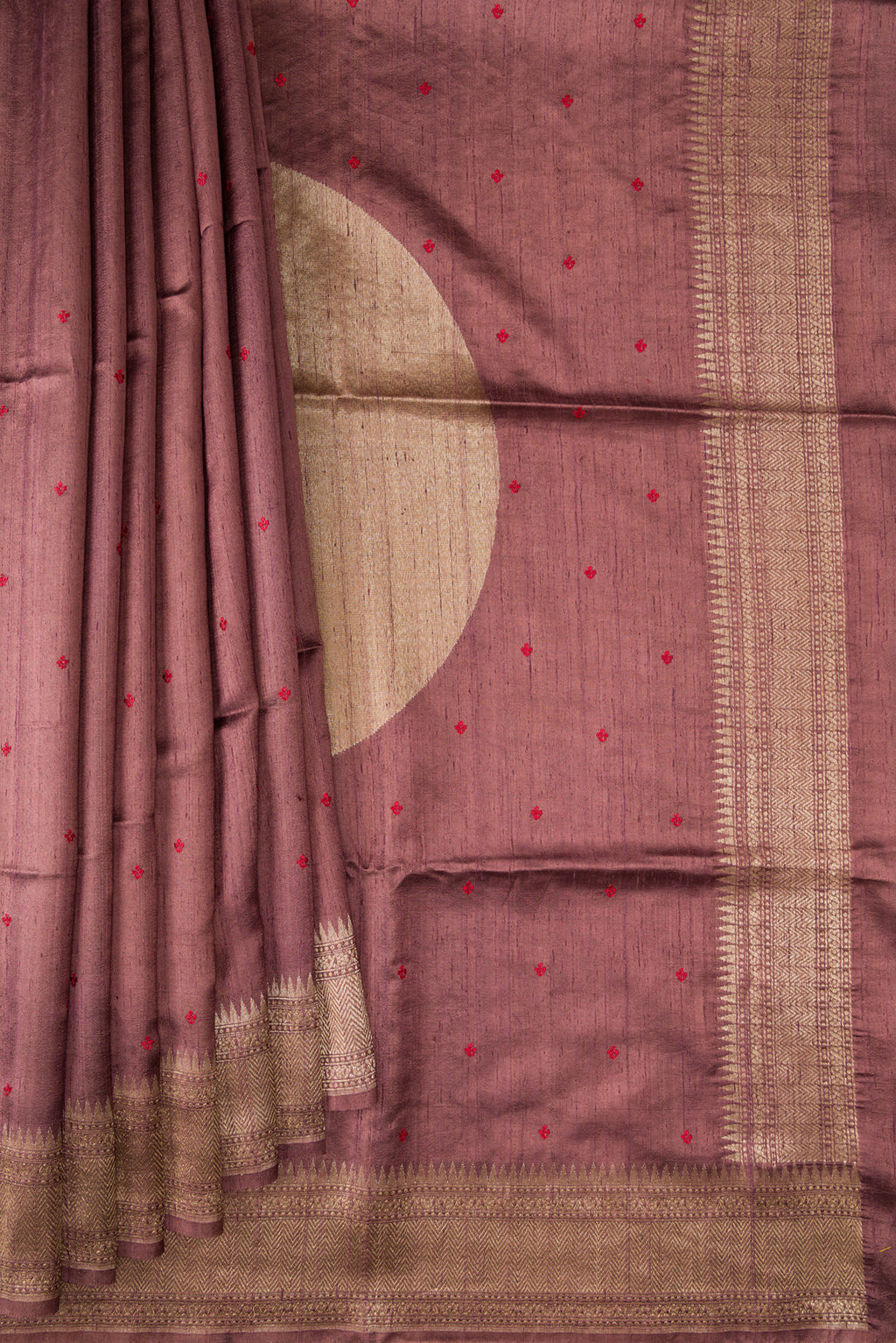 Pleats and pallu of Brown Tussar Saree with Thread Butta on the body and Fancy Border. 
