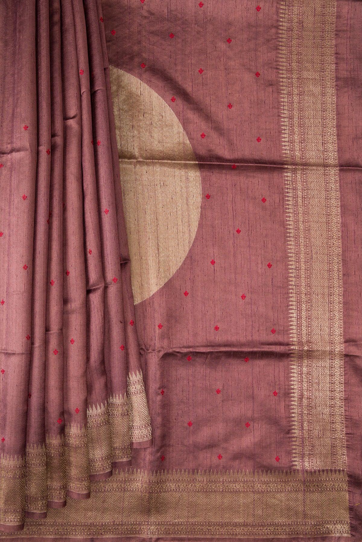 Pleats and pallu of Brown Tussar Saree with Thread Butta on the body and Fancy Border. 