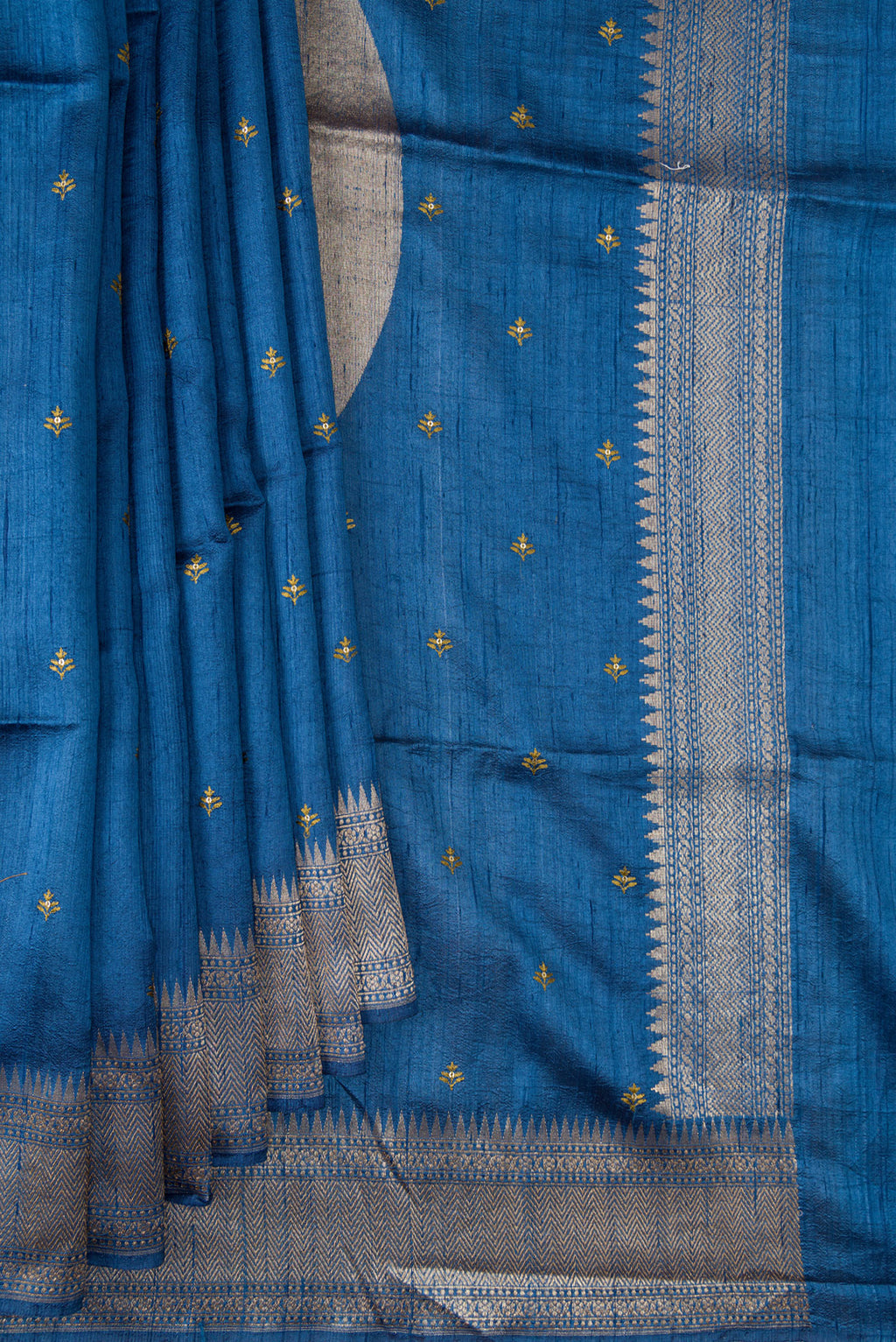 Pleats and pallu of Blue Tussar Saree with Embroidered on the body and Fancy Border. 