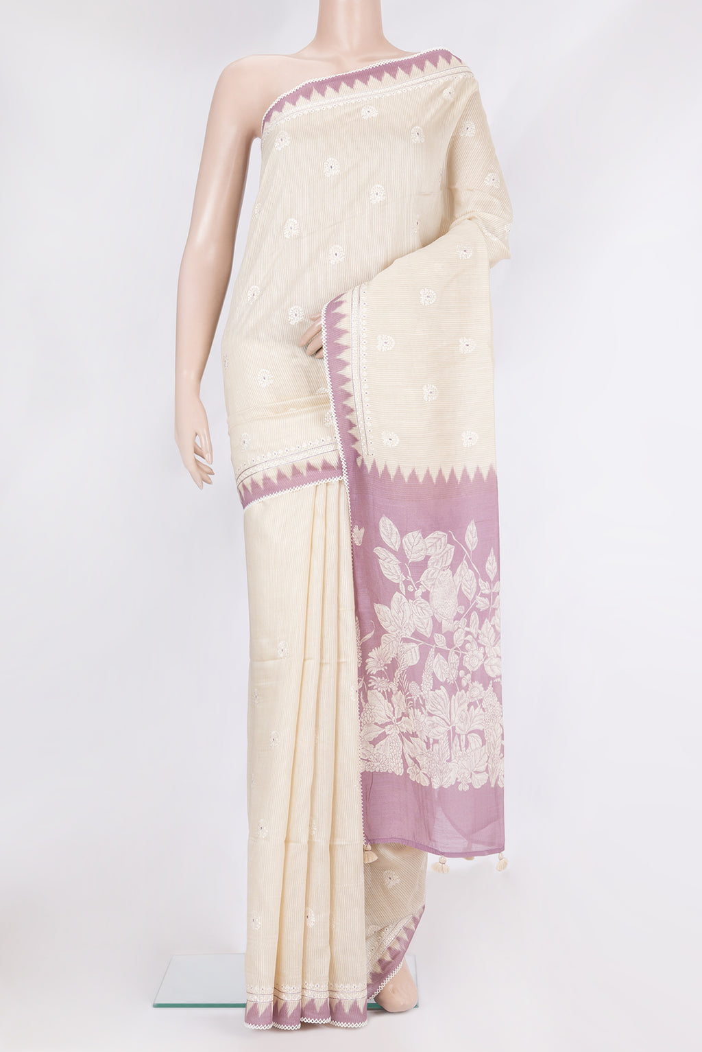 Cream Tussar Saree with Embroidery on the body and Embroidery Border.  displayed on a mannequin