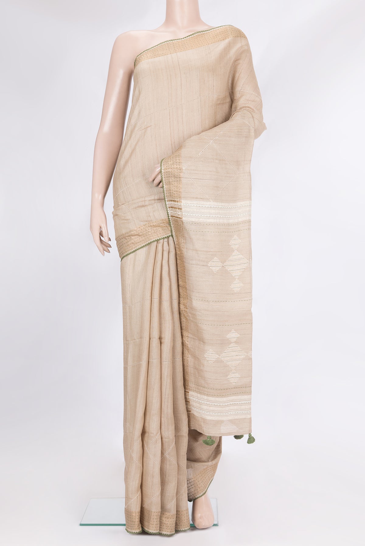 Pure Silk Beige Tussar Saree with Checked design on the body and Embroidery Border.  displayed on a mannequin