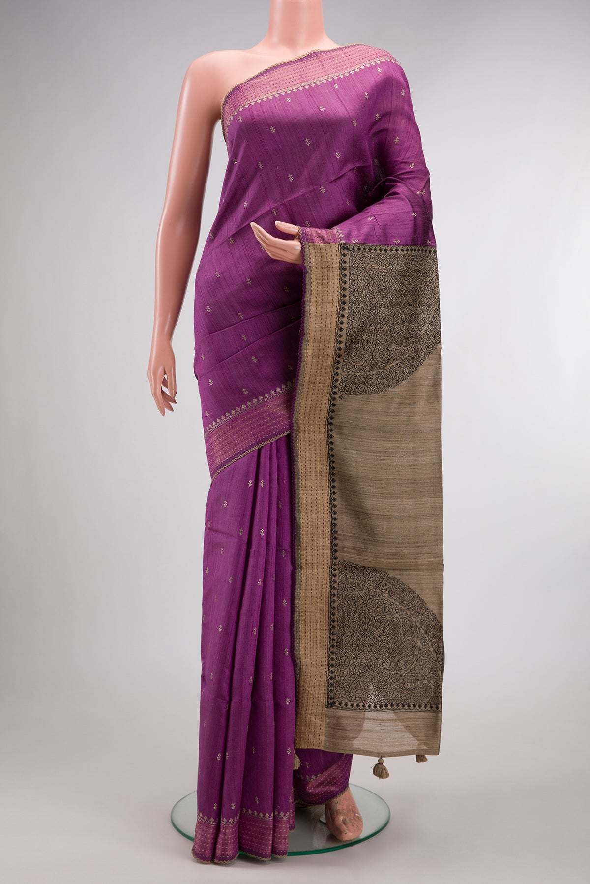Light Magenta Tussar Saree with Thread Butta on the body and Embroidered Border.  displayed on a mannequin