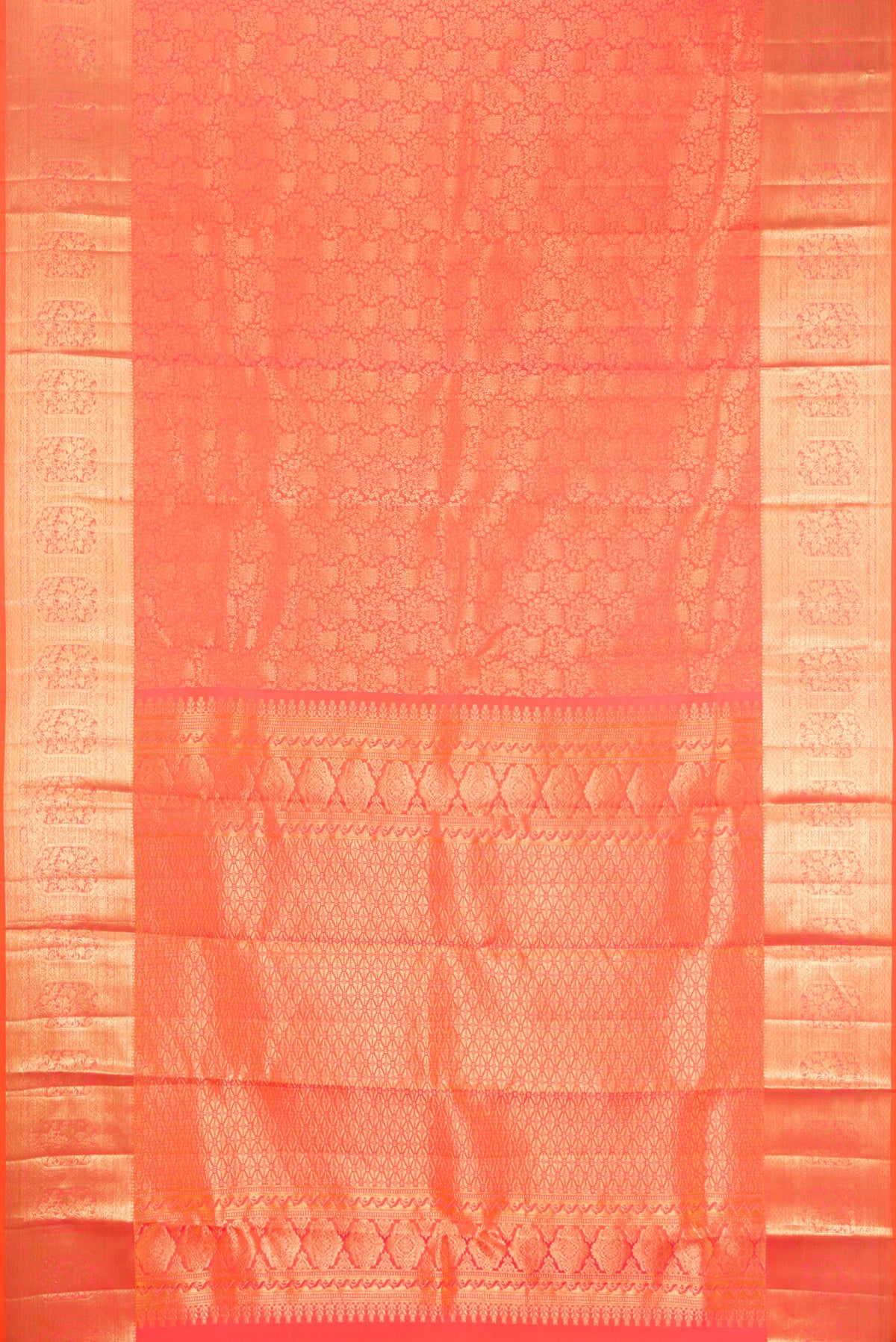 Flat view of Coral Dual Tone Kanchipuram Silk Saree with Zari Brocade on the body and Zari Border. 