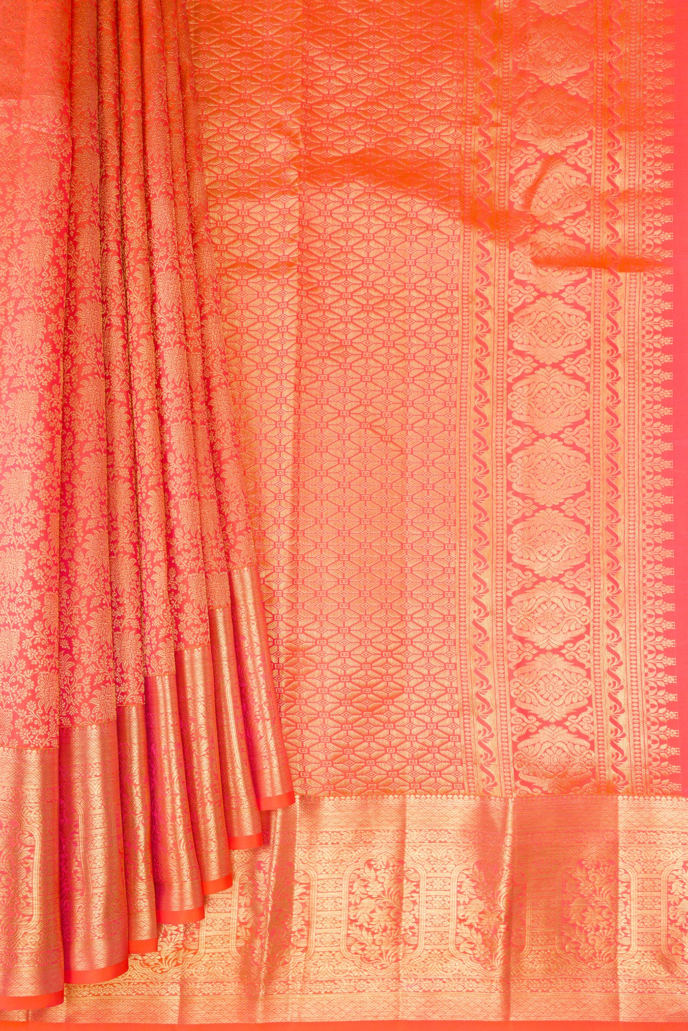 Pleats and pallu of Coral Dual Tone Kanchipuram Silk Saree with Zari Brocade on the body and Zari Border. 
