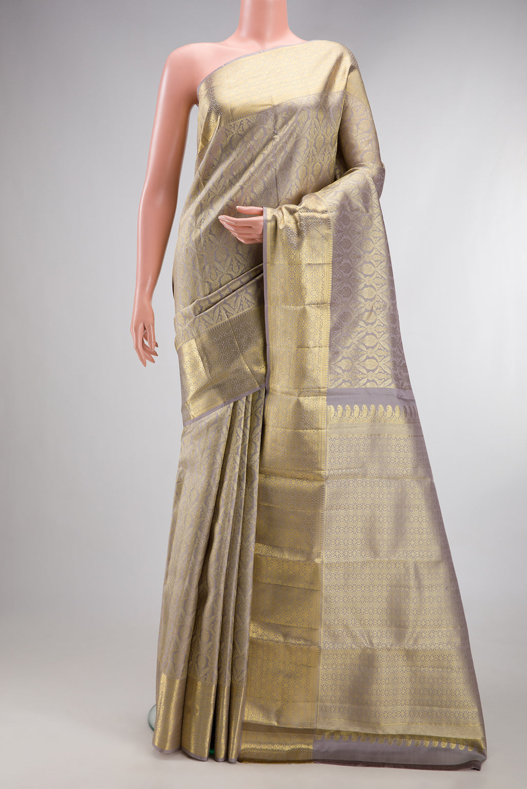 Davys Grey Kanchipuram Silk Saree with Zari Brocade on the body and Zari Border.  displayed on a mannequin