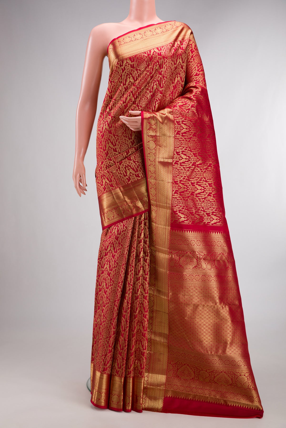 Pure Silk Red Dual Tone Kanchipuram Saree with Zari Brocade on the body and Zari Border.  displayed on a mannequin