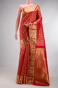 Red Kanchipuram Silk Saree with Zari Brocade on the body and Zari Border.  displayed on a mannequin