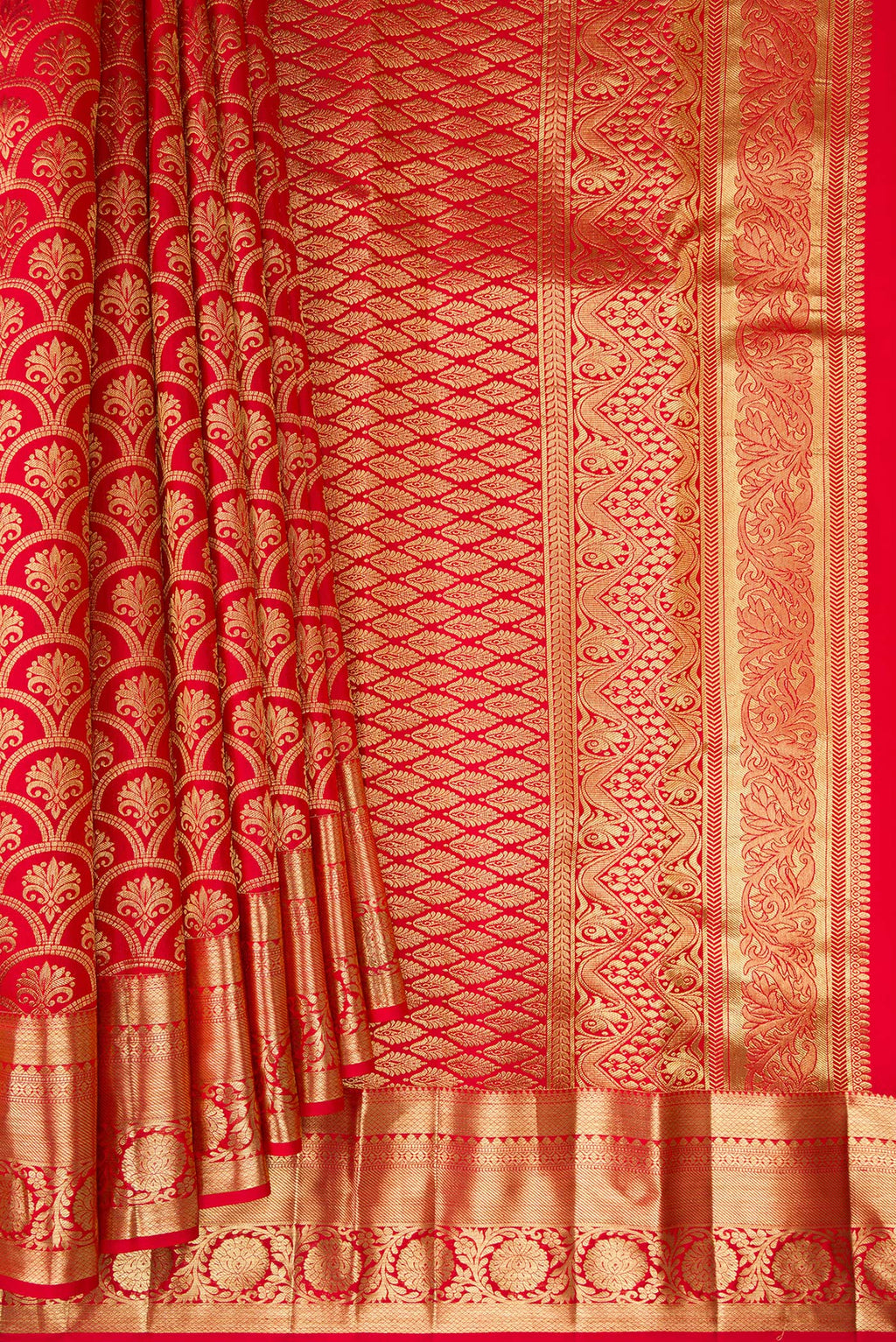 Pleats and pallu of Red Kanchipuram Silk Saree with Zari Brocade on the body and Zari Border. 