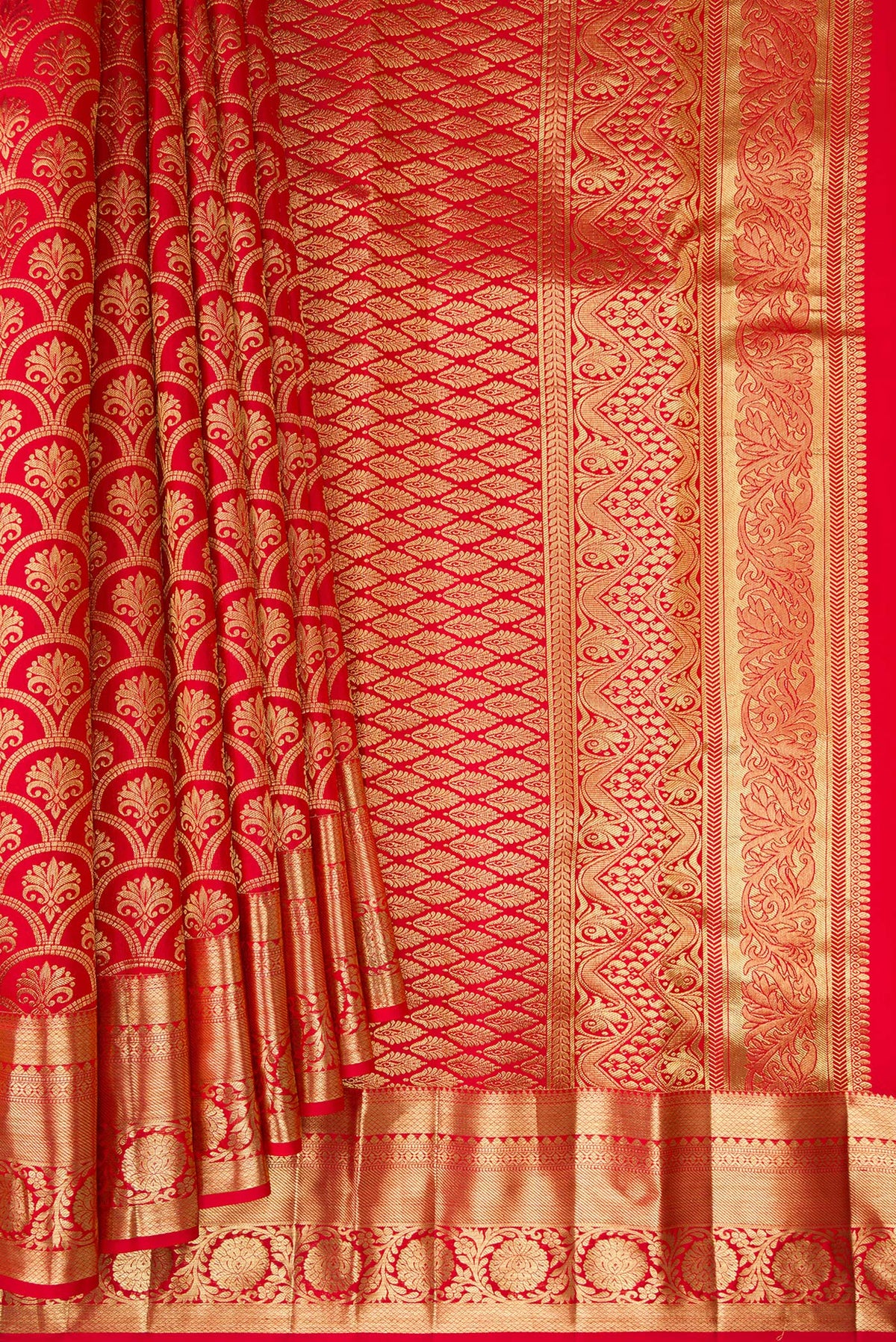 Pleats and pallu of Red Kanchipuram Silk Saree with Zari Brocade on the body and Zari Border. 