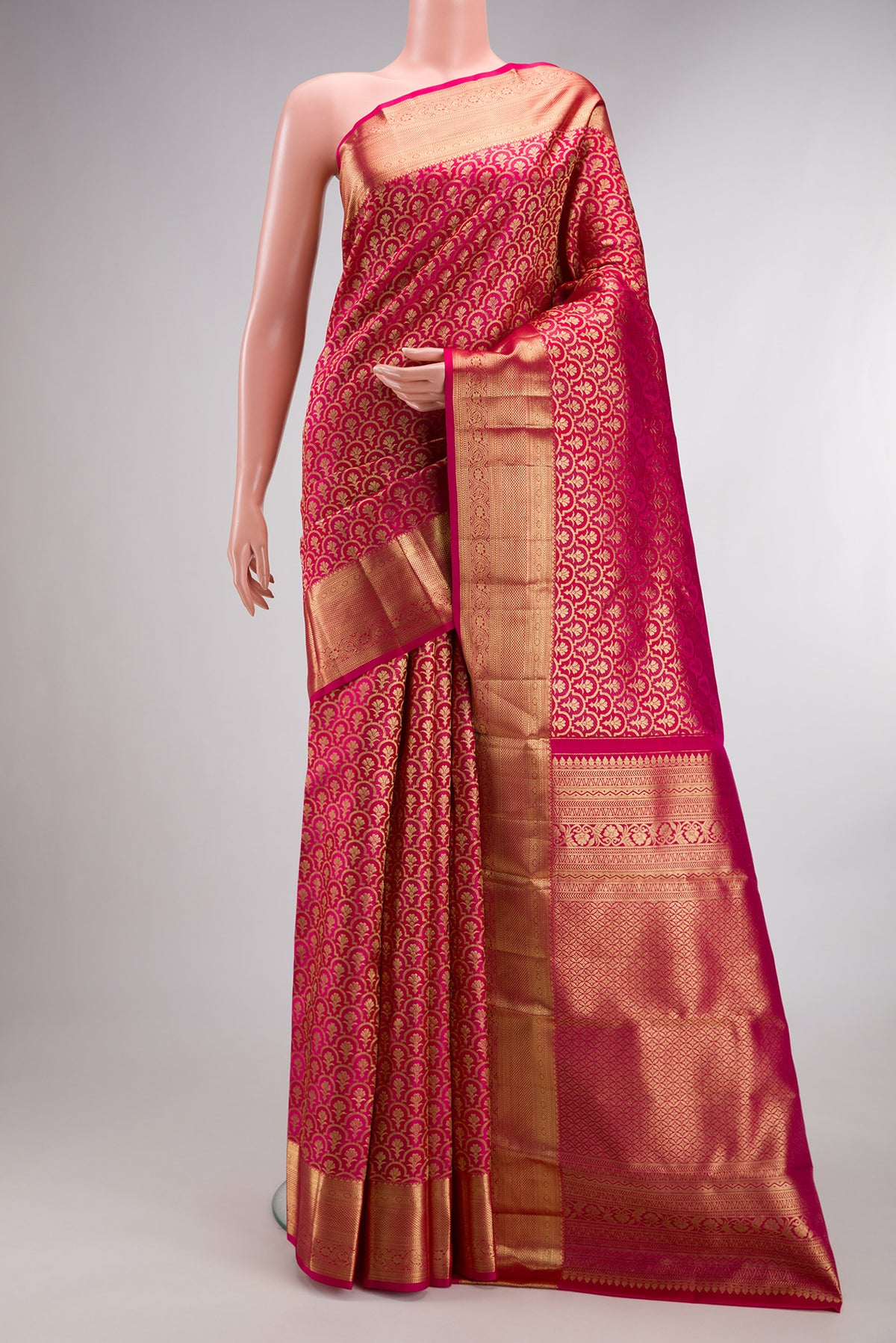Pure Silk Dark Pink Dual Tone Kanchipuram Saree with Zari Brocade on the body and Zari Border.  displayed on a mannequin