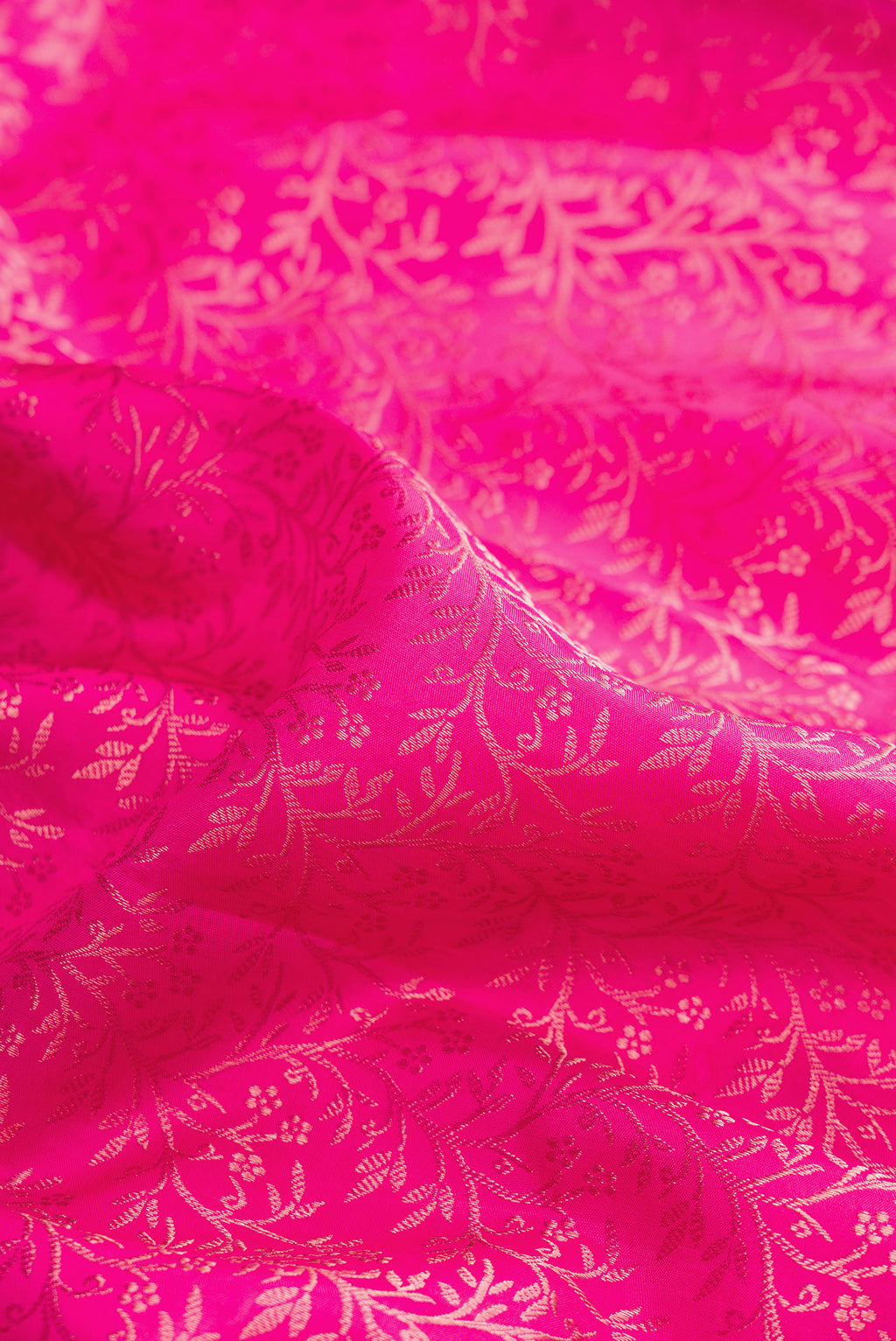 Close up of Pure Silk Pink Kanchipuram Saree with Zari Brocade on the body and Fancy Border.  displaying folds