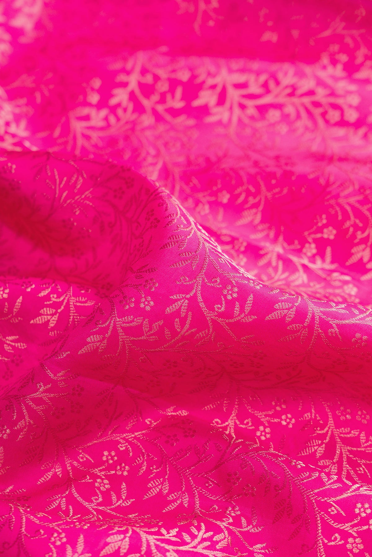 Close up of Pure Silk Pink Kanchipuram Saree with Zari Brocade on the body and Fancy Border.  displaying folds